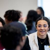 Girls of Color Summit previous event people conversing in a conversation at the event